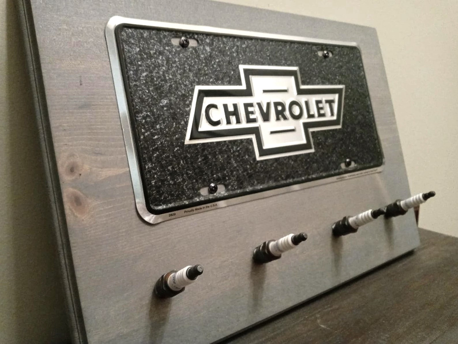 Chevy - Black License Plate Spark Plug Rack